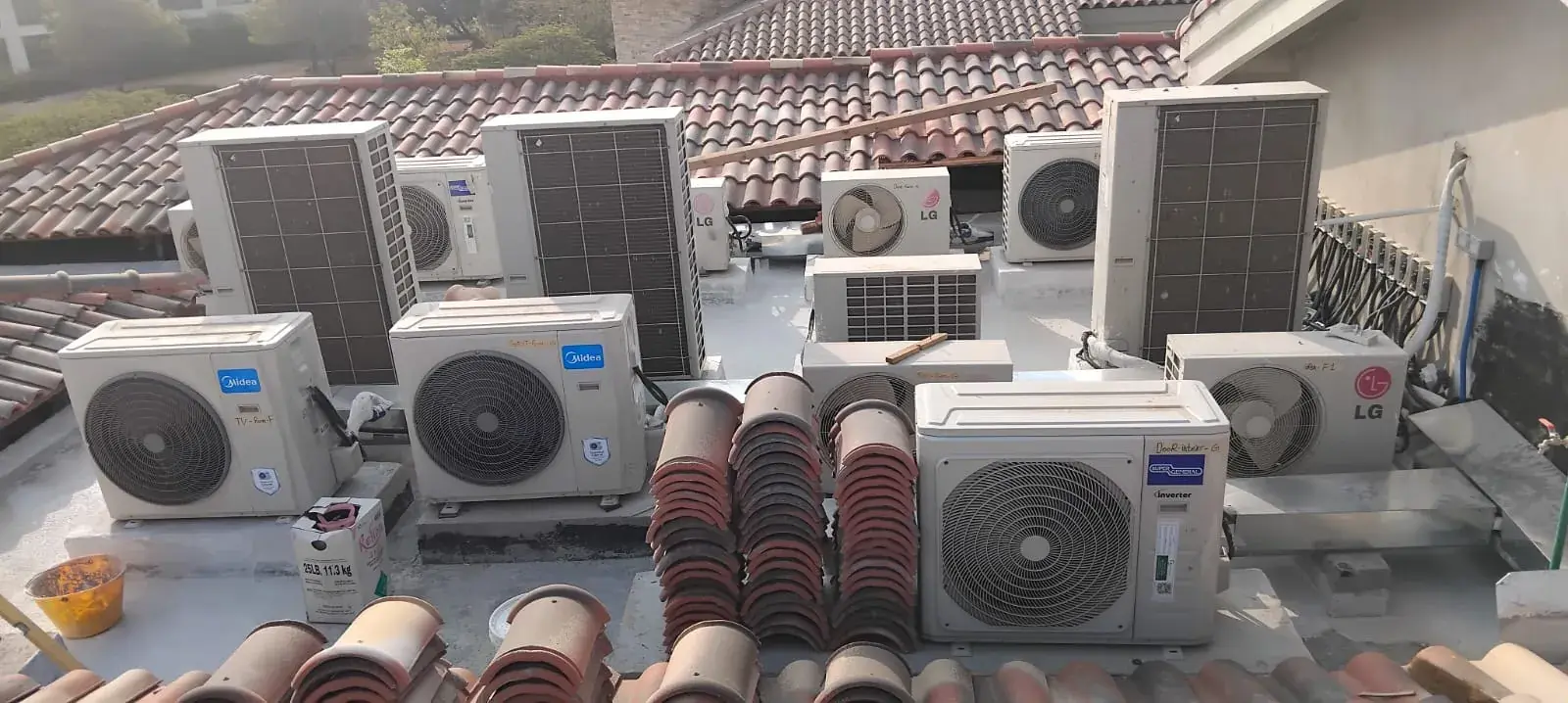Row of AC outdoor units installed on a villa rooftop