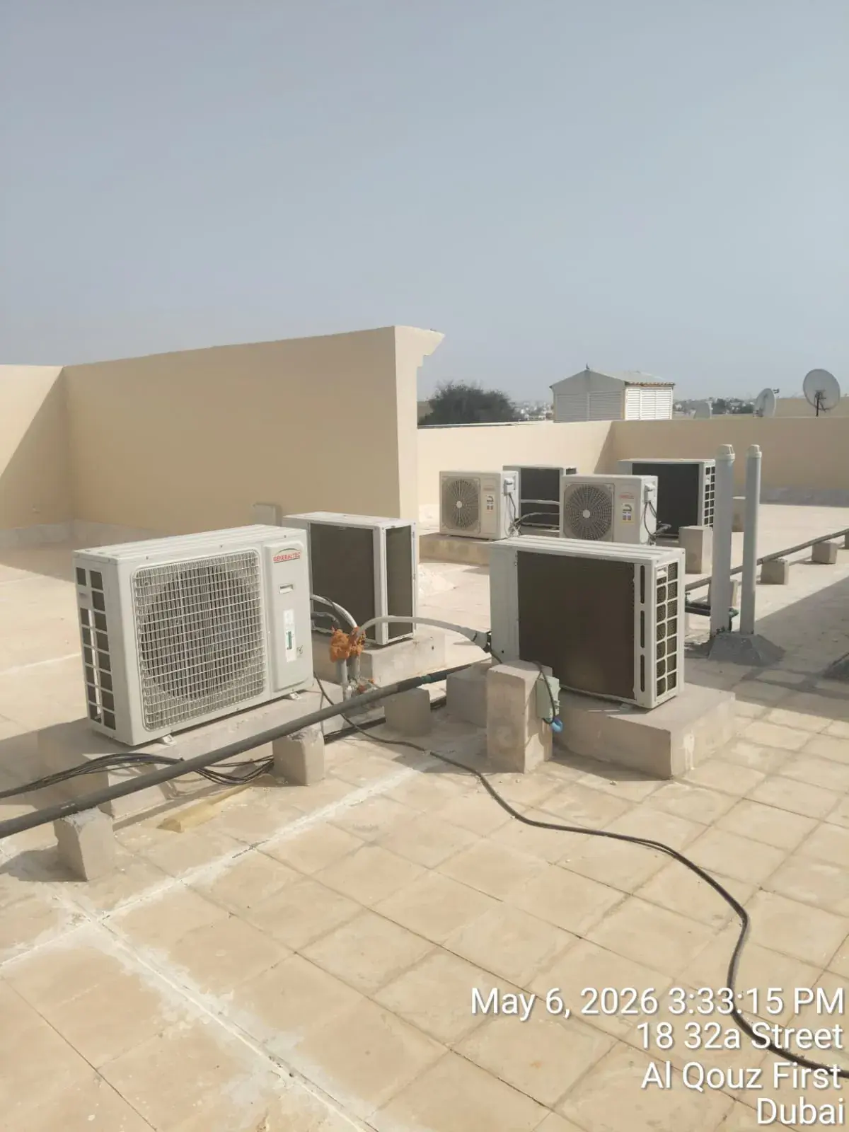 AC condensing units on a villa rooftop