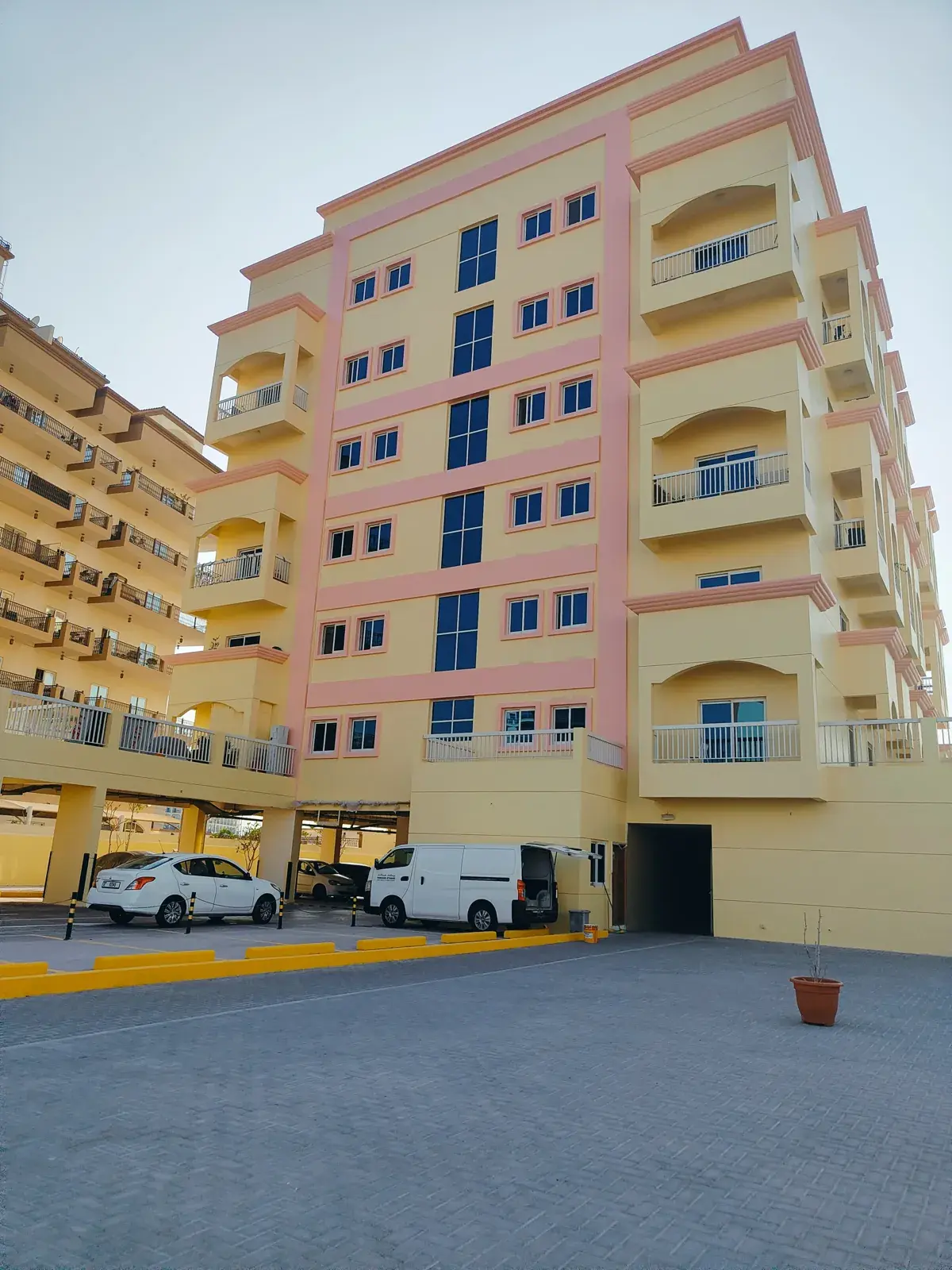 Seven-storey residential building with balconies and car park
